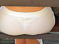 Oh my, what arousing assjeans! That cutie's white pants are so tight and thin, you can see her sexy string panty shining through.